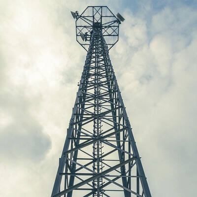 Durable angle steel tower designed with hot dip galvanized treatment for 4G 5G signal transmission and wireless coverage in complex environments